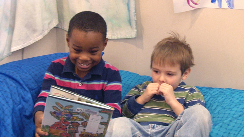 Boys reading a book