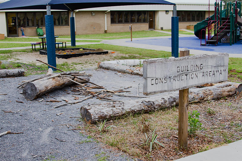 An outdoor space with a sign reading "Building Construction Area 'A'"