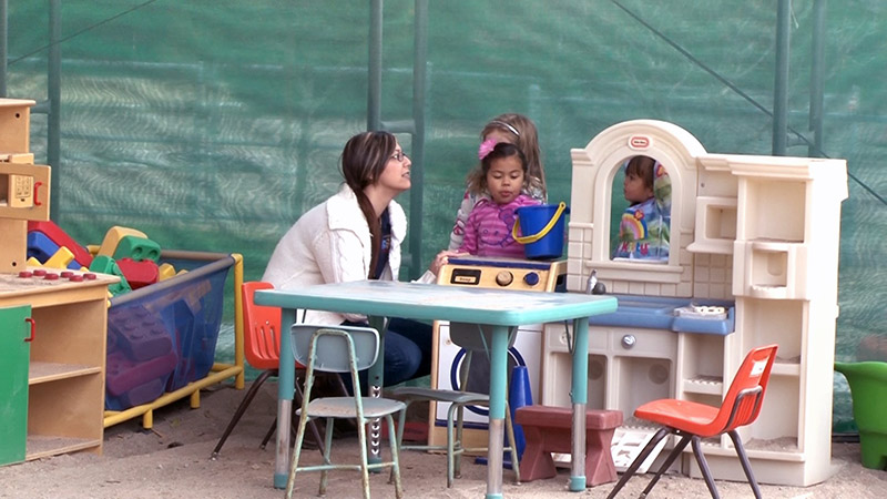 Caregiver with preschoolers